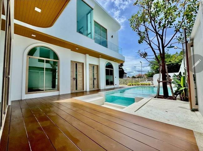 Pool villa with a timber poolside deck