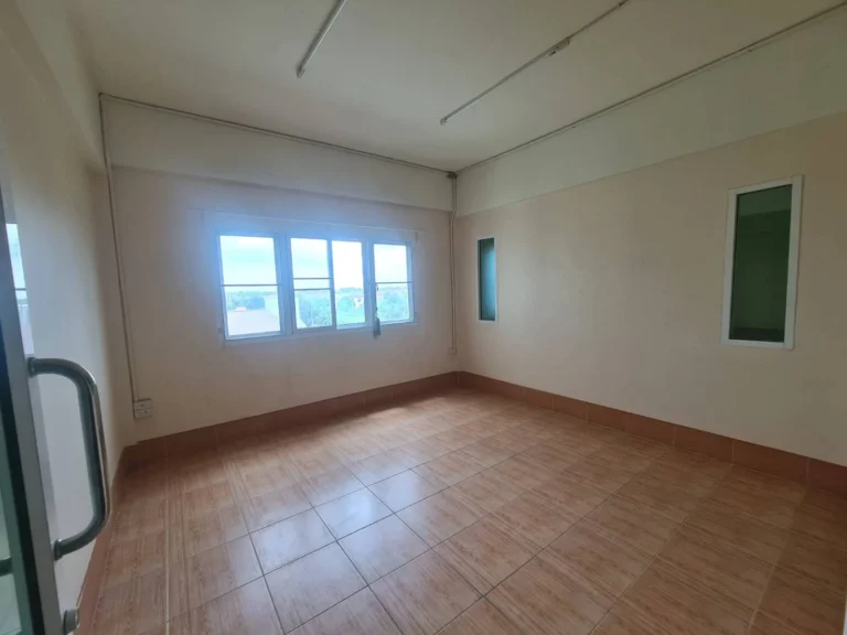 Bright, open tiled room that can serve as a study or office