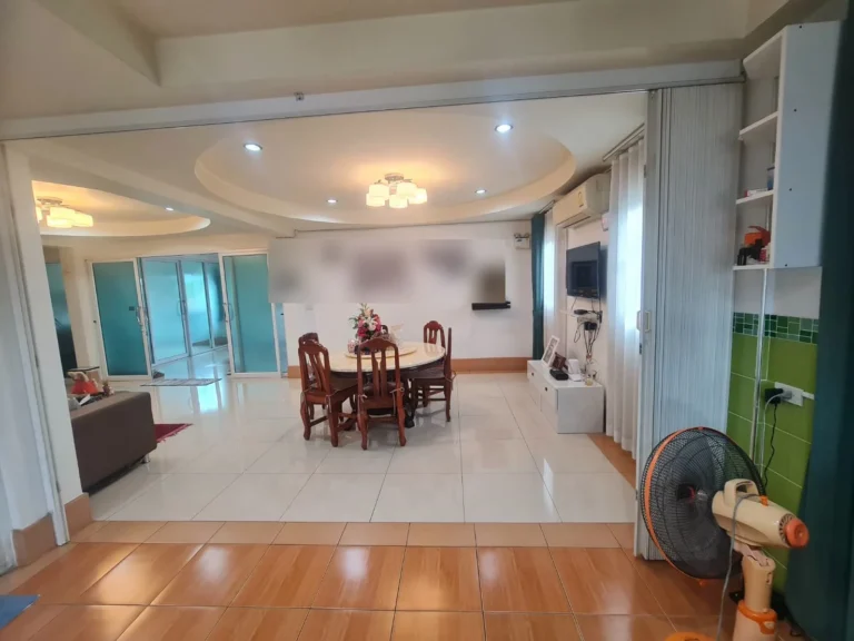 Dining and living area under a round drop ceiling