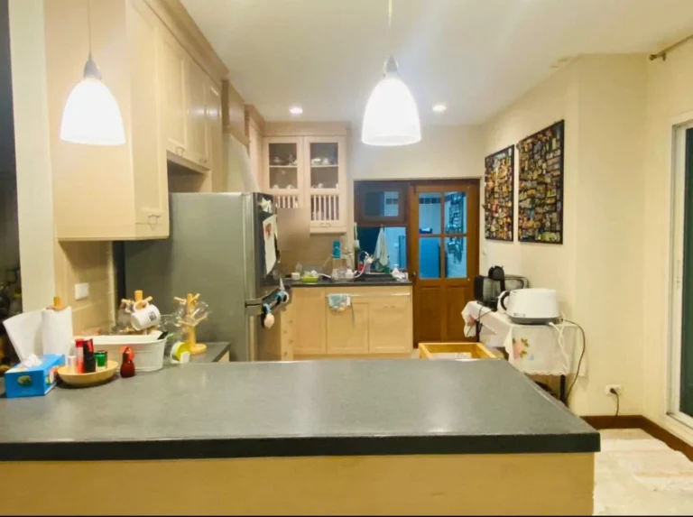 Kitchen with an island counter and cream cabinets