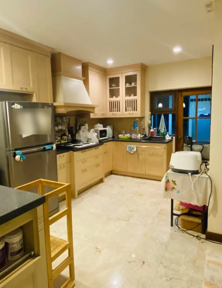 Kitchen with a cooker hood and glass-front cabinets