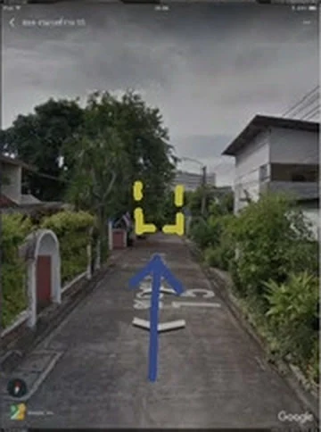 The 6 m wide road in front of the plot