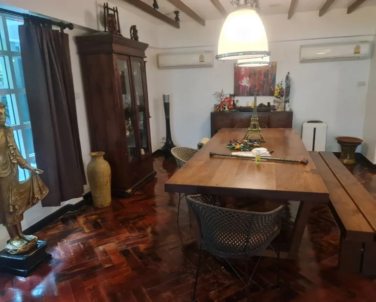 Dining room under dark timber beams