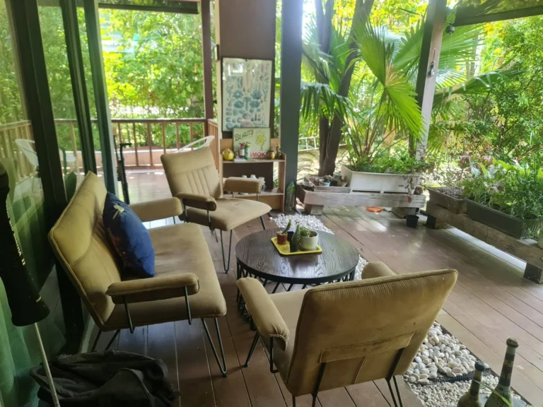 Covered wooden deck beside the garden