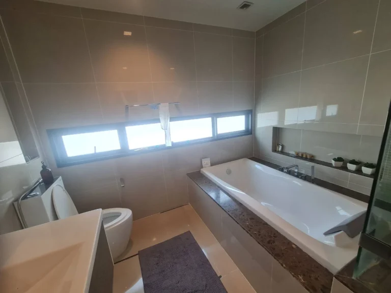 Master bathroom with a bathtub