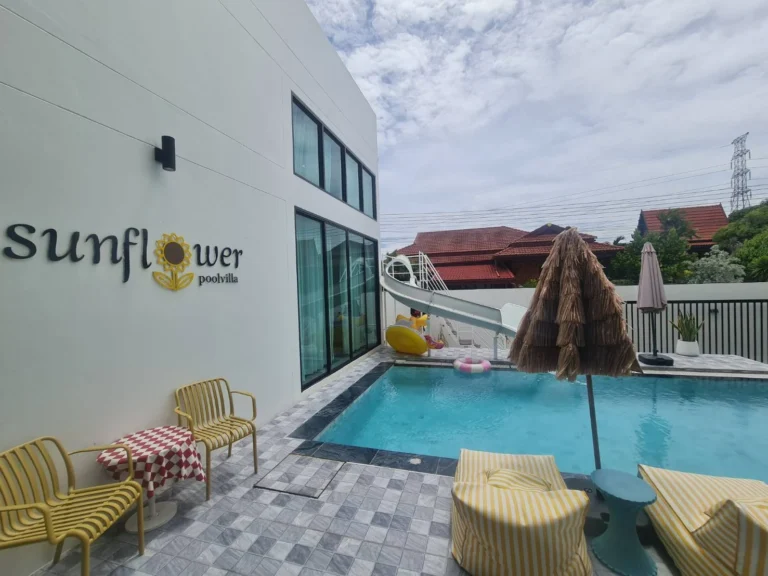 Sunflower poolvilla sign on the wall beside the pool