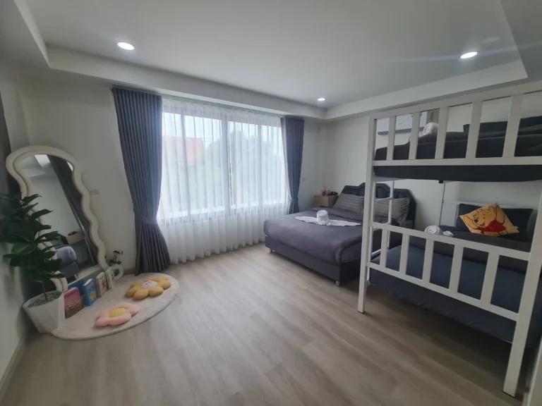 Family room with bunk beds and a double bed