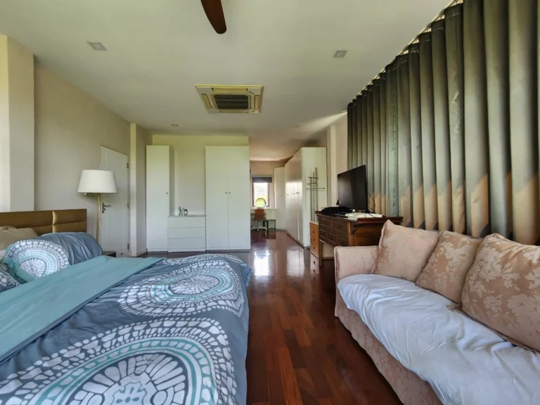 Wall of wardrobes in the master bedroom
